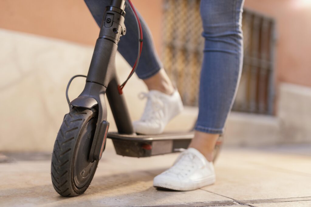 young woman rides electrical scooter city(1)
